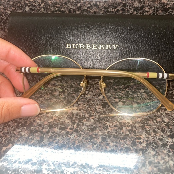 Authentic Burberry Sunglasses. With gold frame and Burberry logo.